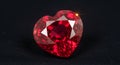 Brilliant heart-shaped ruby gemstone on black background Royalty Free Stock Photo
