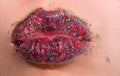 Brilliant make-up, lipstick on female lips, shine glitter and creative make-up for party, luxury sexy mouth. Sexual