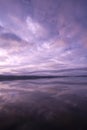 Brilliant pastel pinks and purples in sunrise over still waters of Lake Carmi in Franklin, VT, USA