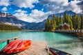 Brilliant red kayaks dry upside down Royalty Free Stock Photo