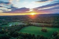 Brilliant Sunset in early fall over Sussex County NJ with large fields and foliage aerial