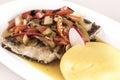 Brine fish plate with vegetables, chili and polenta, placed on white plate Royalty Free Stock Photo