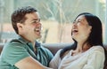 We bring out the best in each other. a happy young couple relaxing on their couch at home. Royalty Free Stock Photo