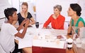 Bringing her expertise to the table. A group of female architects working together on a project at a conference table. Royalty Free Stock Photo