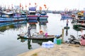 Bringing water and food for Vietnamese fishermen living on boats on the sea in Da Nang, Vietnam