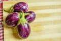 Brinjal, Eggplant, or Aubergine, on Wooden Background