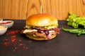 Brioche Smash Double Beef Cheese Burger with tomato sauce and green chilli isolated on table side view of fastfood Royalty Free Stock Photo