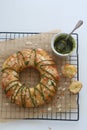 Brioche topped with almonds and glazed with matcha chocolate