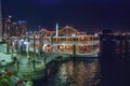 Brisbane, Australia - August 14, 2009: River tourist ferry and night city skyline Royalty Free Stock Photo