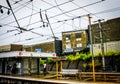 Brisbane Australia - Bowen Hills train station with commuters waiting in the rain