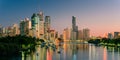 Brisbane city skyline and river at sunrise.