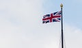 Brisitsh Union Jack Flag Blowing in Wind Royalty Free Stock Photo