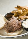 Brisket beef sandwich steak fries barbecue sauce Royalty Free Stock Photo