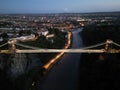 Bristol Clifton suspension bridge lit at Sunset over the Cumberland Basin