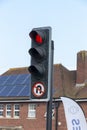 A close up view of a red robot or traffic light