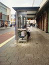 Bus stop in front of Sainsbury`s Local,