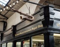 Bristol, UK - February 12 2020:  A saxophone hangs above the sign for  The Bristol Musical Instrument Repair Shop Royalty Free Stock Photo