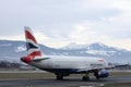 British Airways airplane taking off from runway, Salzburg Airport