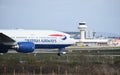 A British Airways Boeing 777-236 callsign G-YMME moves towards the runway for takeoff at Gatwick Airport