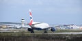 A British Airways Boeing 777-236 callsign G-YMME moves towards the runway for takeoff at Gatwick Airport