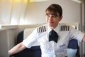 British Airways Middle Aged Female Captain Pilot in an Airplane cabin