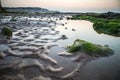 British beach at low tide after sunset, England, UK