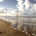 British beach sands gentle waves beautiful sky lonely sign