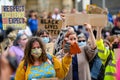 British BLM protesters wear PPE Face Masks and hold homemade signs at Black Lives Matter protest in Richmond, North Yorkshire