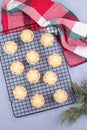 British Christmas mince pies or tarts with fruit filling, on a cooling rack, vertical, top view Royalty Free Stock Photo