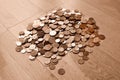 British currency, hundreds of copper and silver coloured coins piled randomly on top of each other