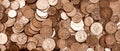 British currency, hundreds of copper and silver coloured coins piled randomly on top of each other