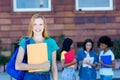 British female student with red hair and group of students Royalty Free Stock Photo