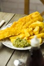 British Fish and Chips on a newspaper print plate Royalty Free Stock Photo