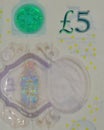 British five pounds banknote fragment closeup