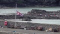 British flag waving halfmast at Cemaes, Wales - United Kingdom