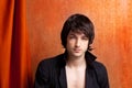 British indie pop rock look young man on orange Royalty Free Stock Photo