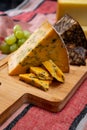 British and Irish cheeses, tasting plate with blue shropshire, brown porter cheese and smoked cheddar