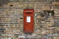 British mailbox on a brick wall in England