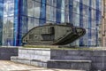 British Mark V Composite tank on a pedestal outdoors against the background of the blue glass