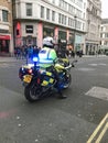 British Metropolitan Police Officer riding Motorbike on Syrian Protest/March