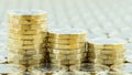 British money, three pound coins descending stacks. Royalty Free Stock Photo