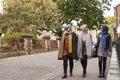 British Muslim Female Friends Walking In Urban Environment