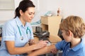 British nurse giving injection to child