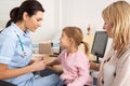 British nurse about to inject young child Royalty Free Stock Photo