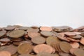 British one and two pence coins laying piled on top of each other with white back ground