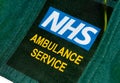 British paramedics`s NHS AMBULANCE SERVICE uniform badge.