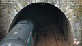 A passenger train passes through the Totley tunnel in the Peak District during May - Sunny overcast day