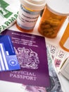 British passport and European health card along with several capsules, concept of medical price in the crisis of Brexit