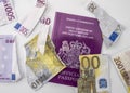 British passport next to broken euro notes Royalty Free Stock Photo