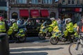 British police motorcyclists and a black London taxi cab at a Freedom for Palestine protest rally